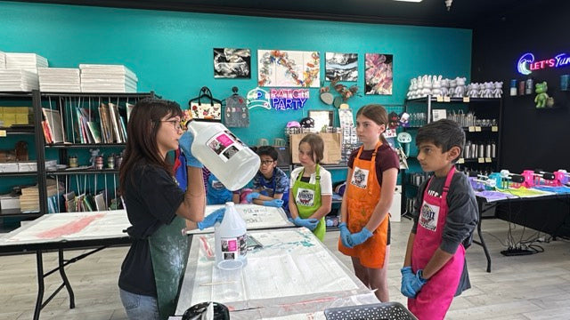 Studio host giving instructions at the start of summer art camp